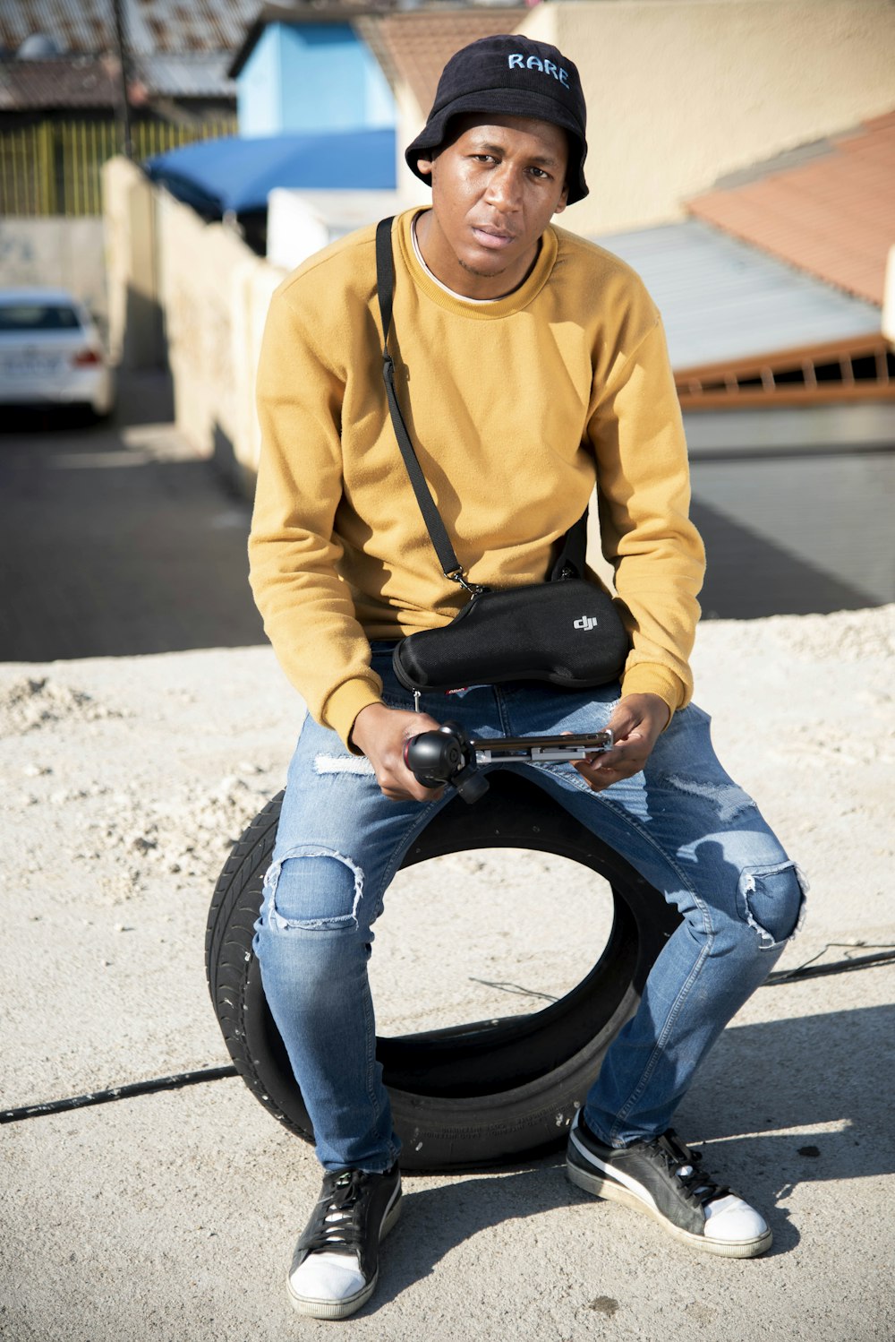 Man in yellow hoodie and blue denim jeans sitting on black wheel chair  photo – Free South africa Image on Unsplash