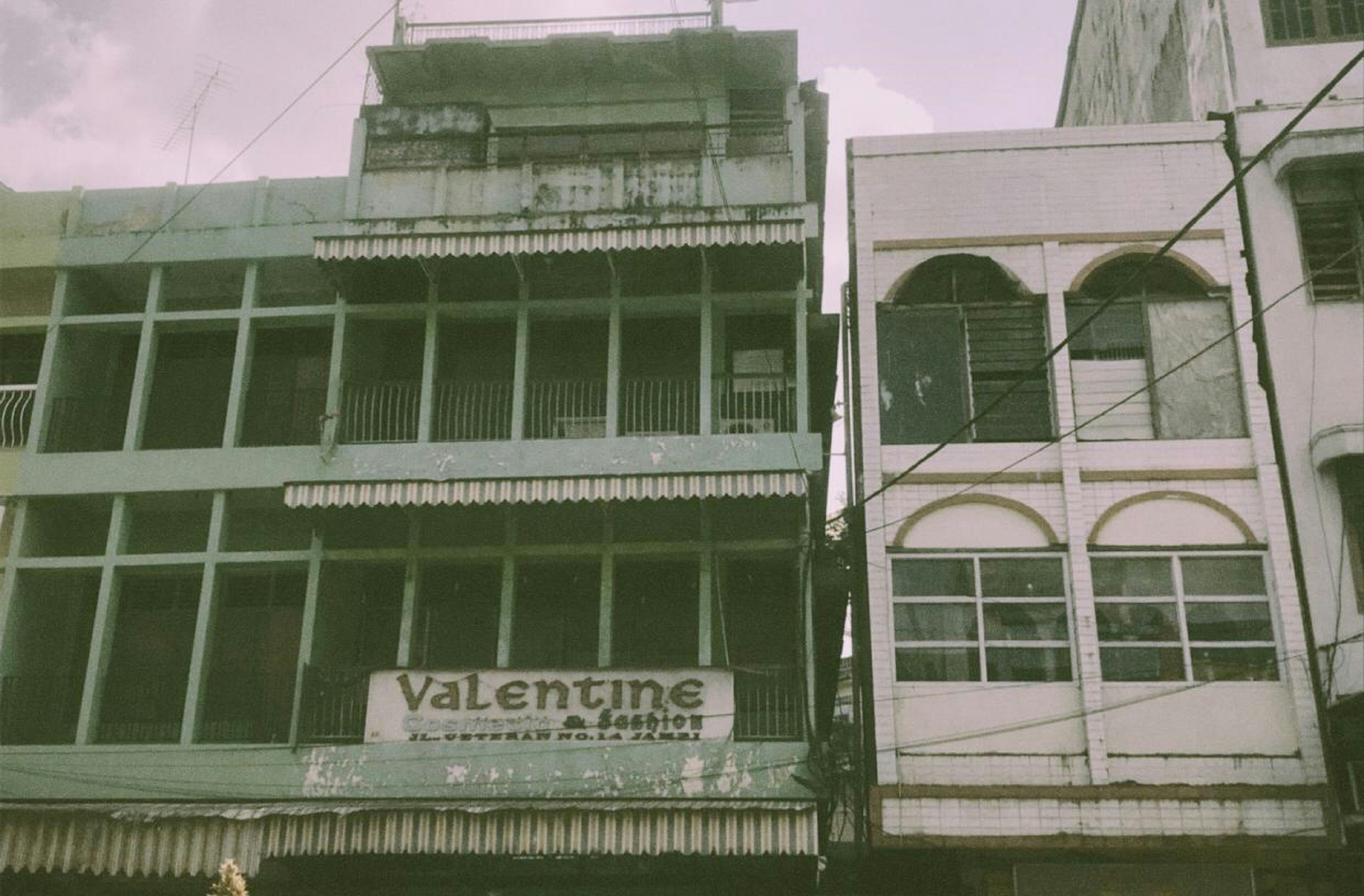 white and black concrete building under blue sky during daytime