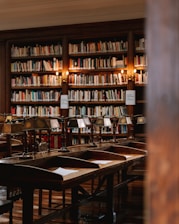 A group of students studying together in a cozy library setting.