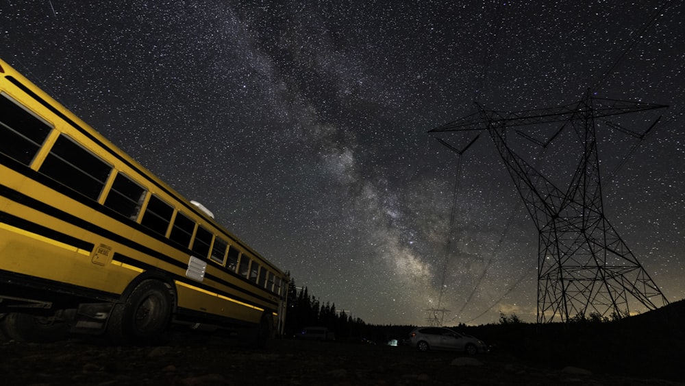 yellow school bus under starry night