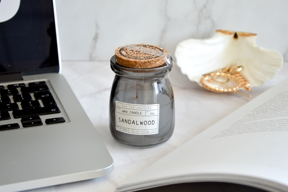 clear glass jar on white table