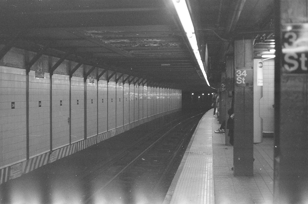 grayscale photo of train station