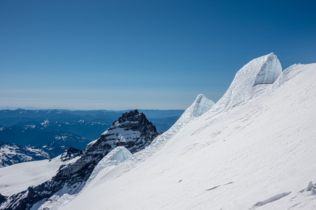 snow covered mountain under blue sky during daytime