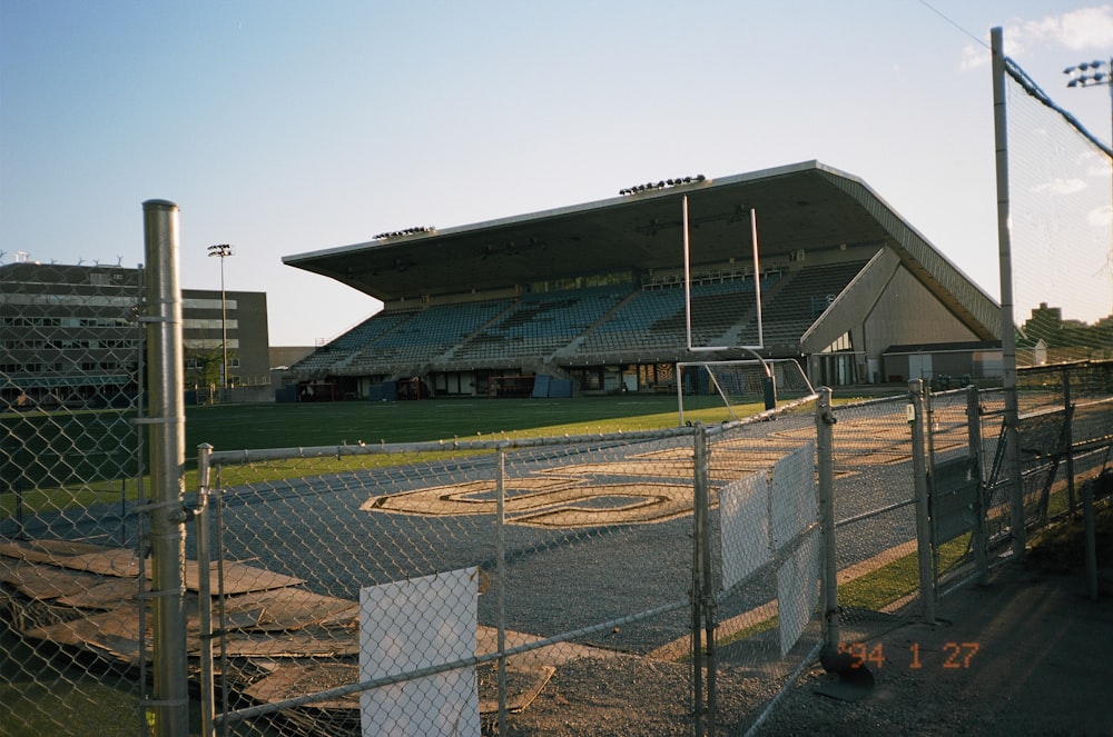 gray and white building near green grass field during daytime