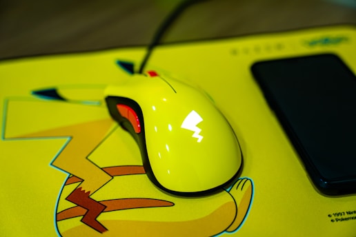 white and black corded computer mouse
