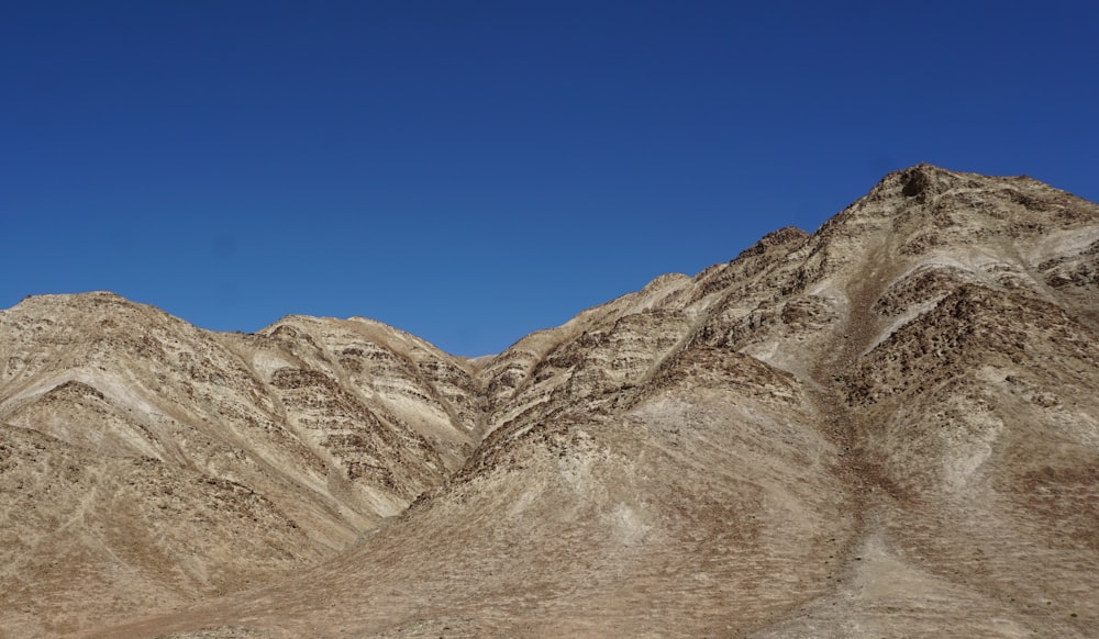 brown and gray mountains under blue sky during daytime