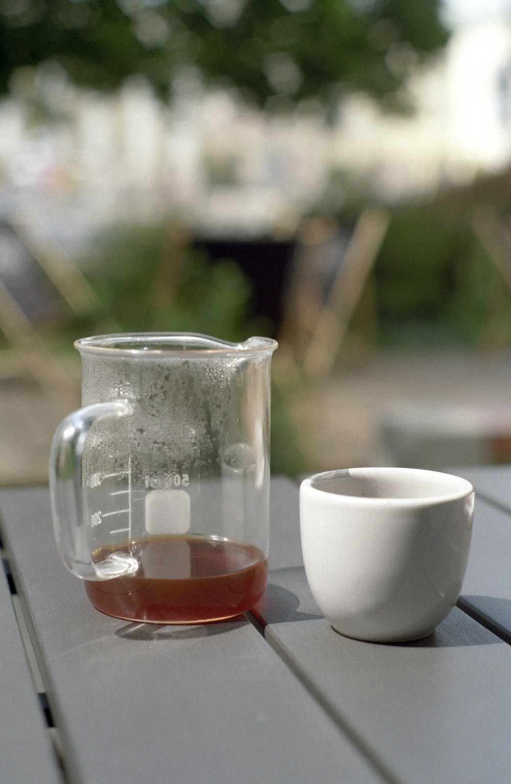 white ceramic pitcher and clear glass pitcher