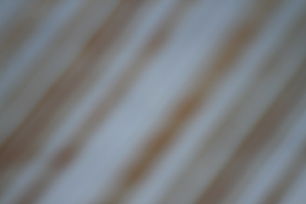 white and brown stripe textile