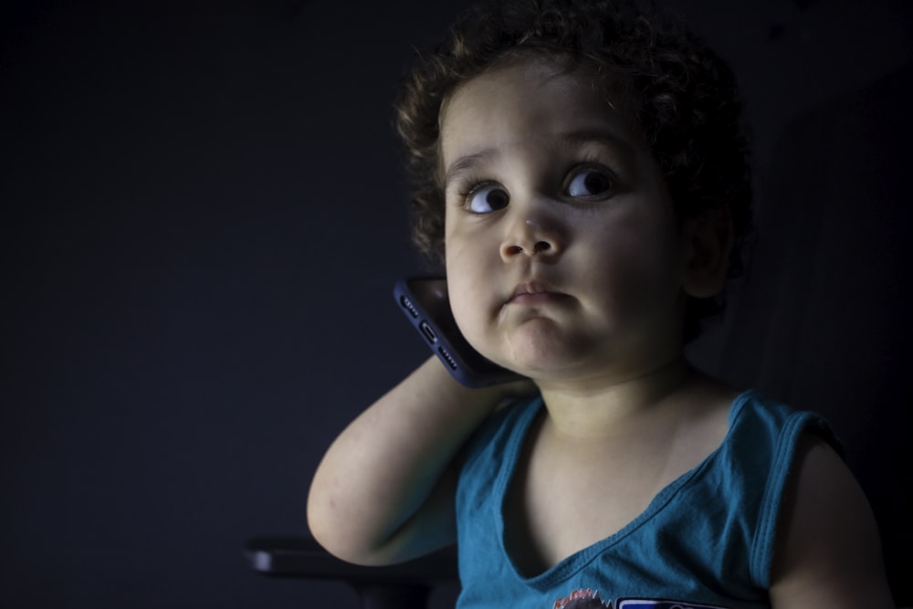 boy in blue tank top