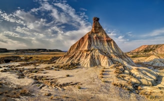 brown rock formation under blue sky during daytime