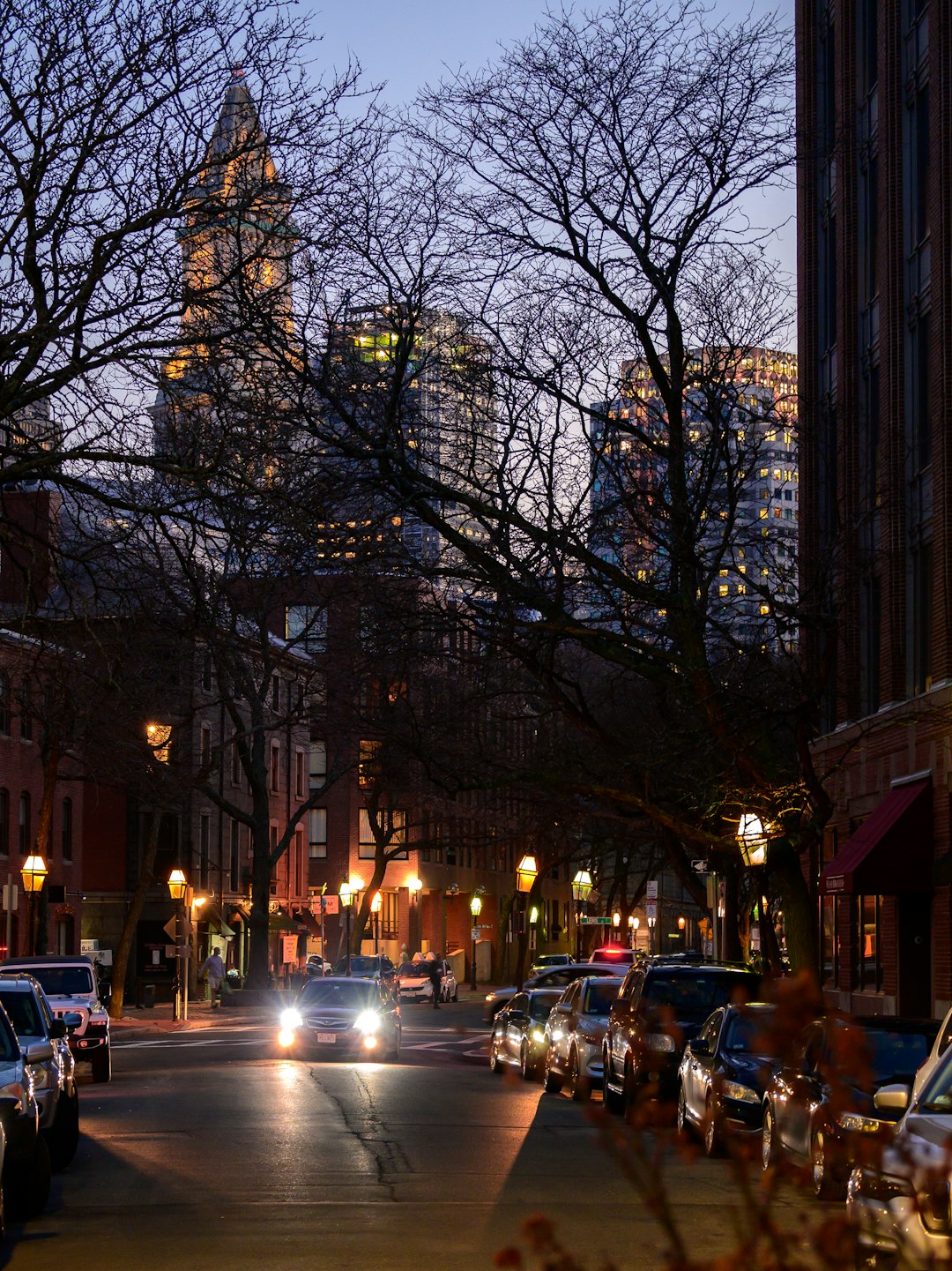 cars parked on side of road during night time