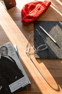 A lifestyle image showing someone using one of the products in a cozy, sunlit workspace.