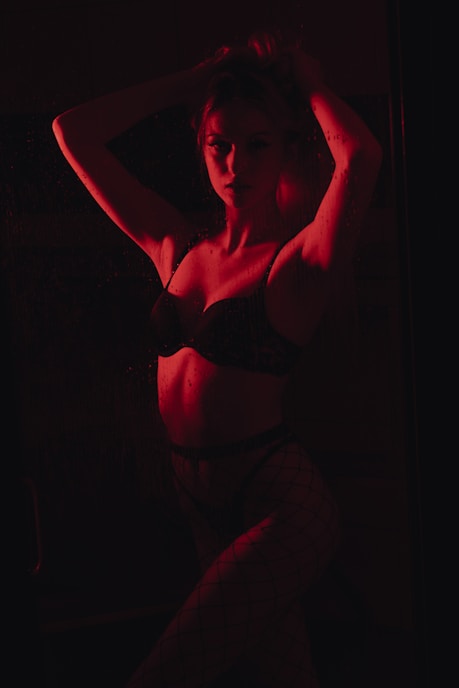 woman in black brassiere and white pants