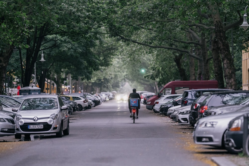 people riding motorcycle on road during daytime