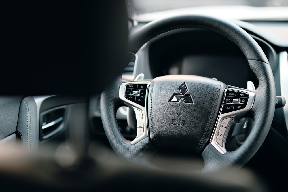 black honda steering wheel in close up photography