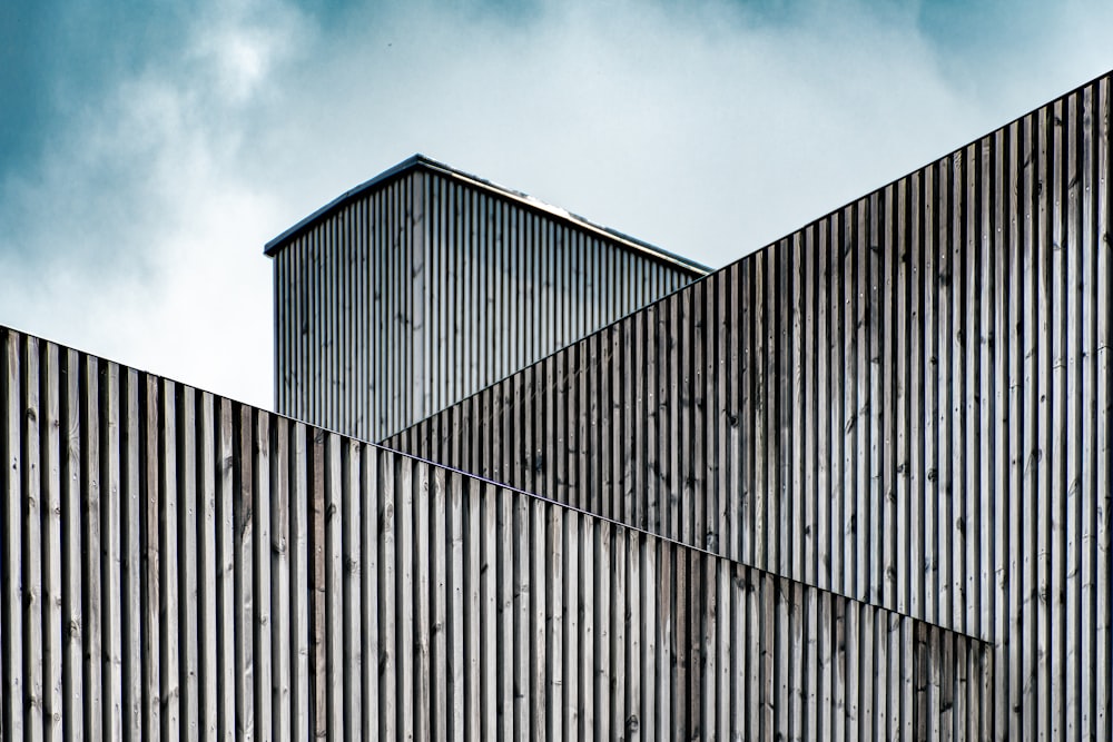 brown wooden building under cloudy sky