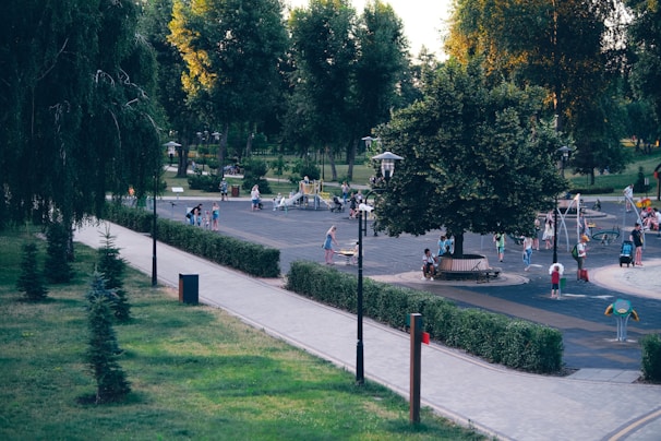 Close-up of a community park with families enjoying green spaces and playgrounds.