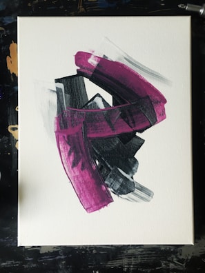 An expansive canvas with sweeping strokes of magenta and cyan that evoke motion.