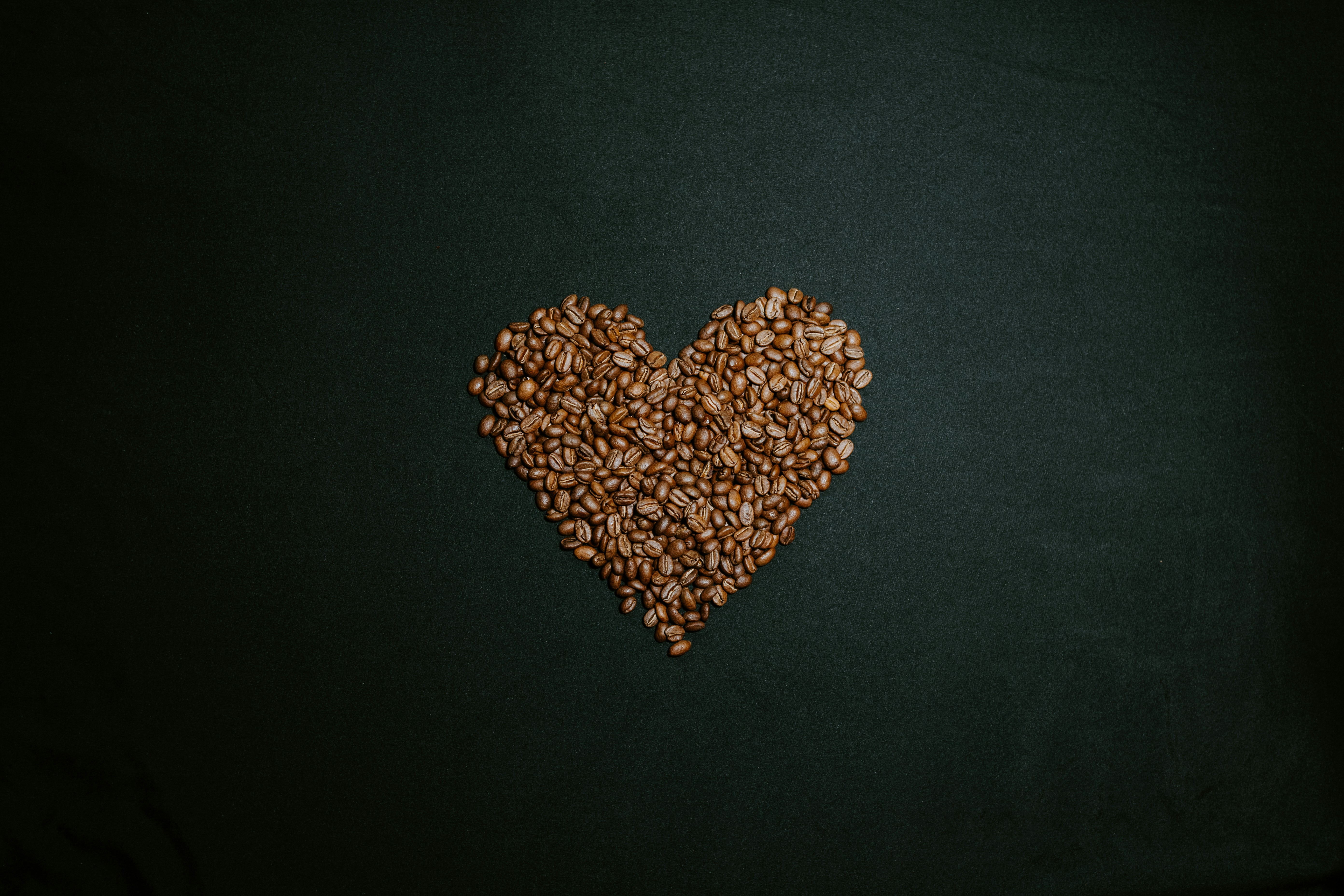brown and white heart shaped beads on black textile