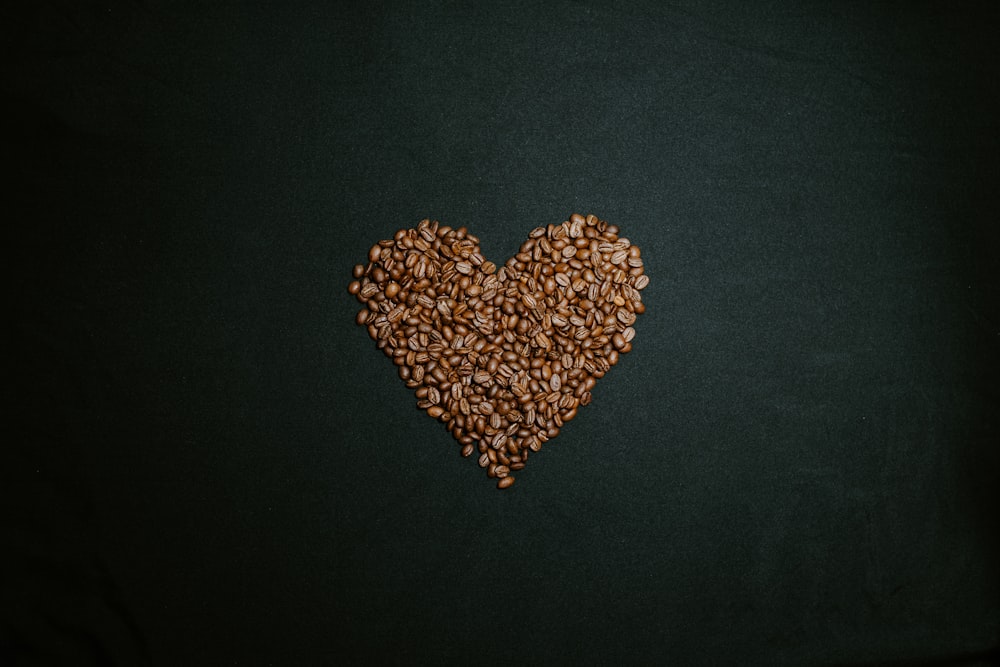 brown and white heart shaped beads on black textile