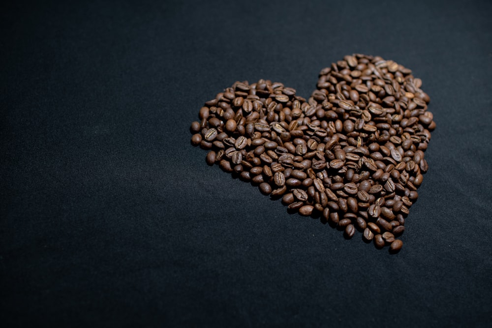 brown coffee beans on black textile