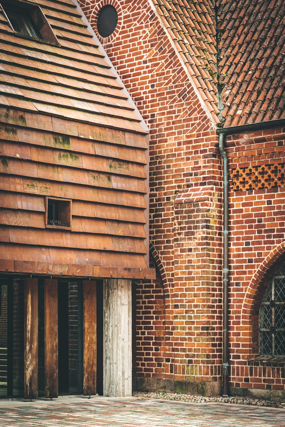 brown brick building with arch windows