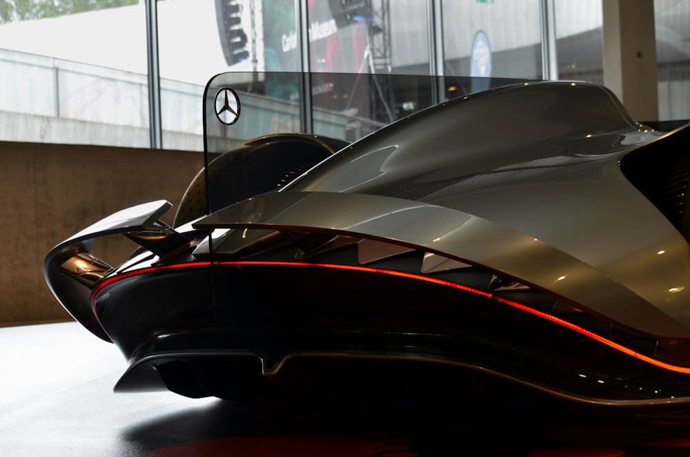 black and red car in front of white wooden table