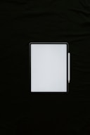 white rectangular device on black textile