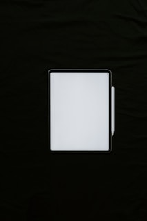 white rectangular device on black textile