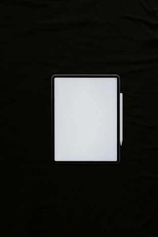 white rectangular device on black textile