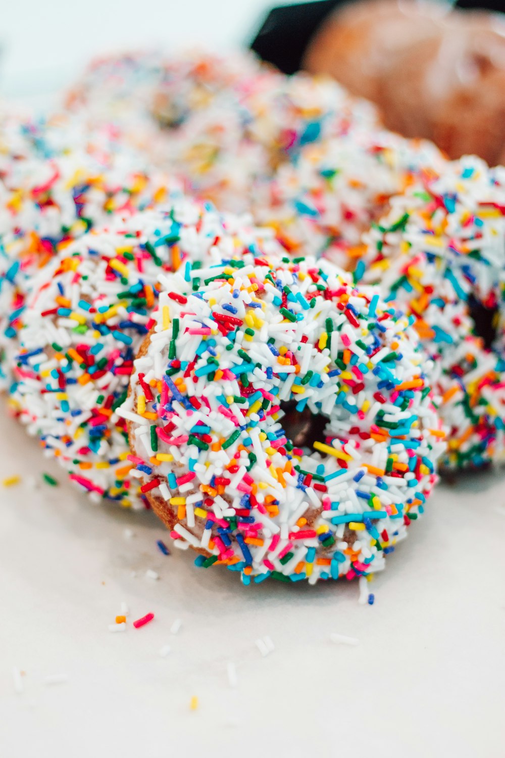 blue green and red sprinkles on white ceramic plate