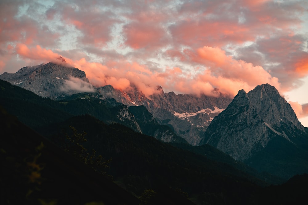 black and white mountains under cloudy sky during daytime