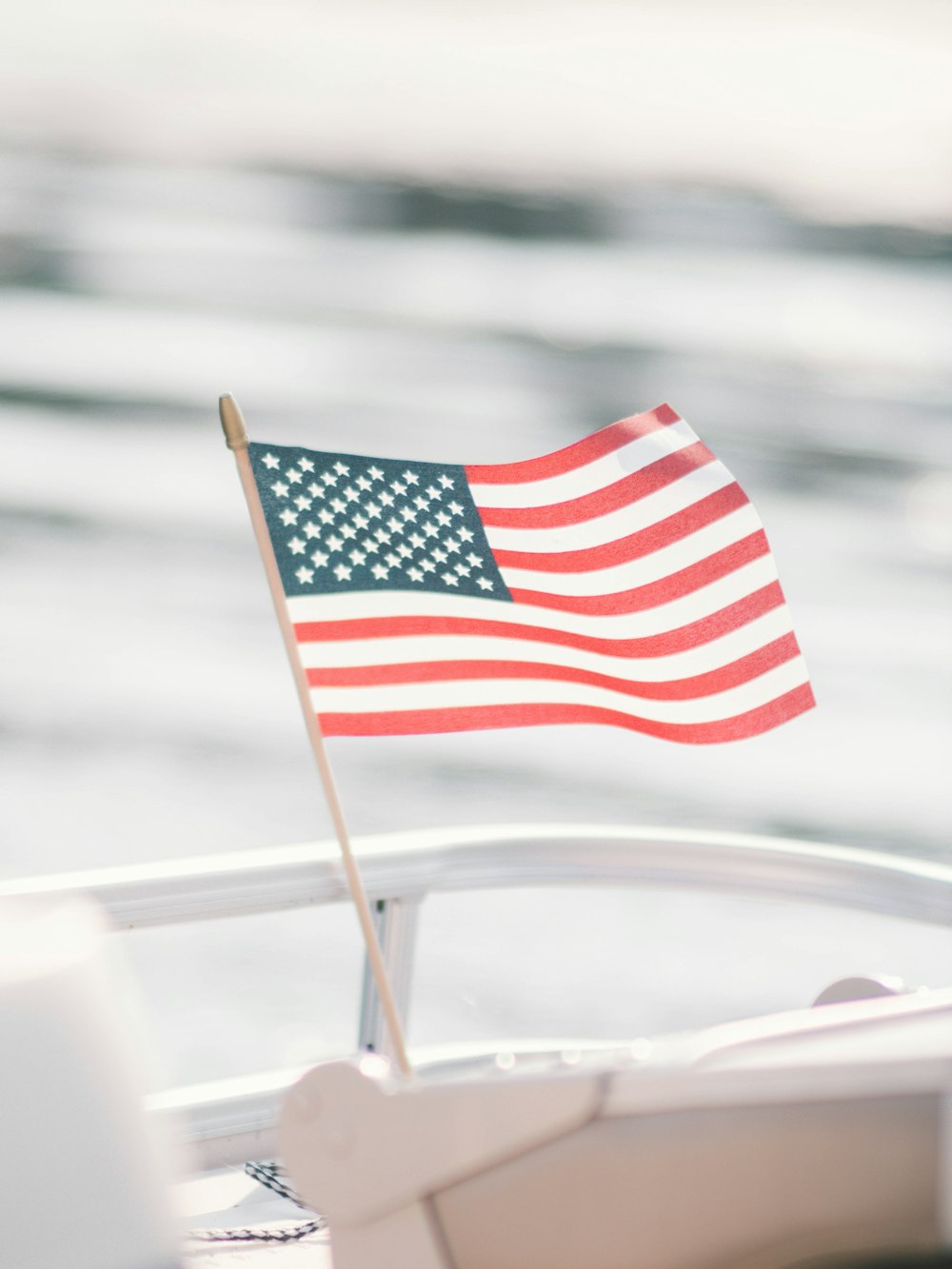 us a flag on white metal fence