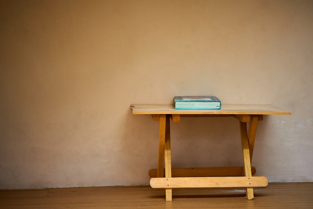 blue book on brown wooden table