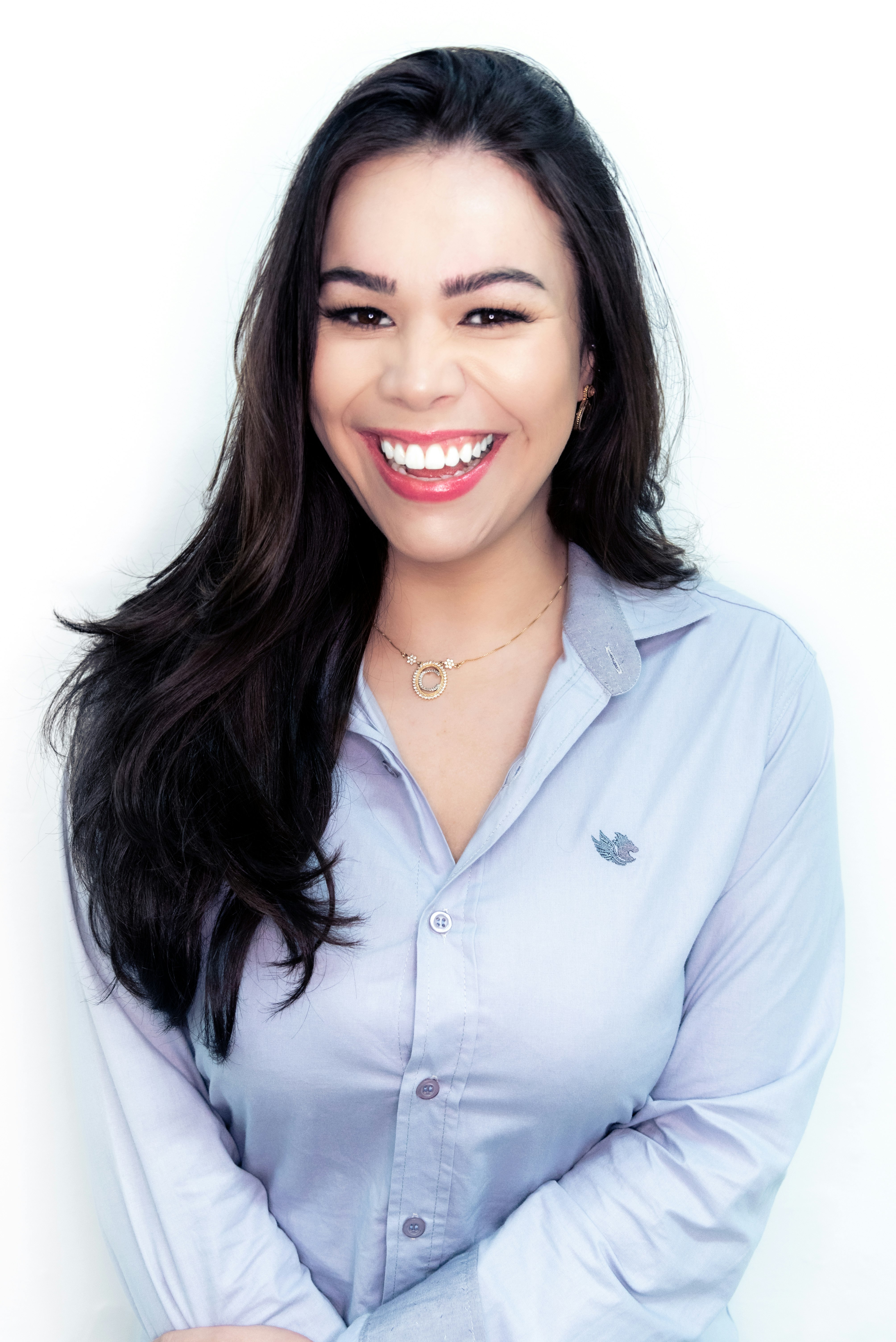 woman in white button up shirt smiling