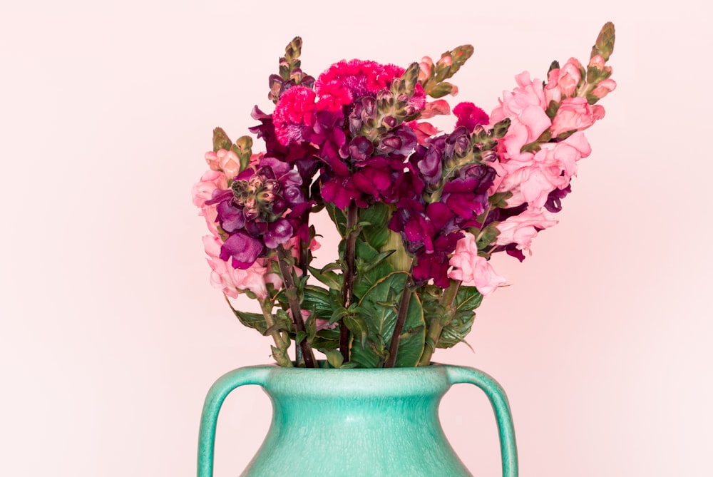 purple flowers in gray ceramic vase