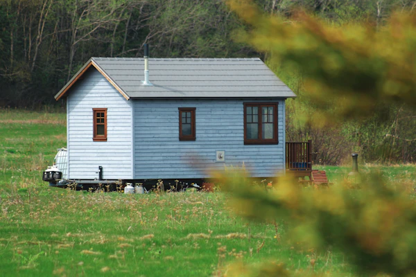 Small wooden house on grass