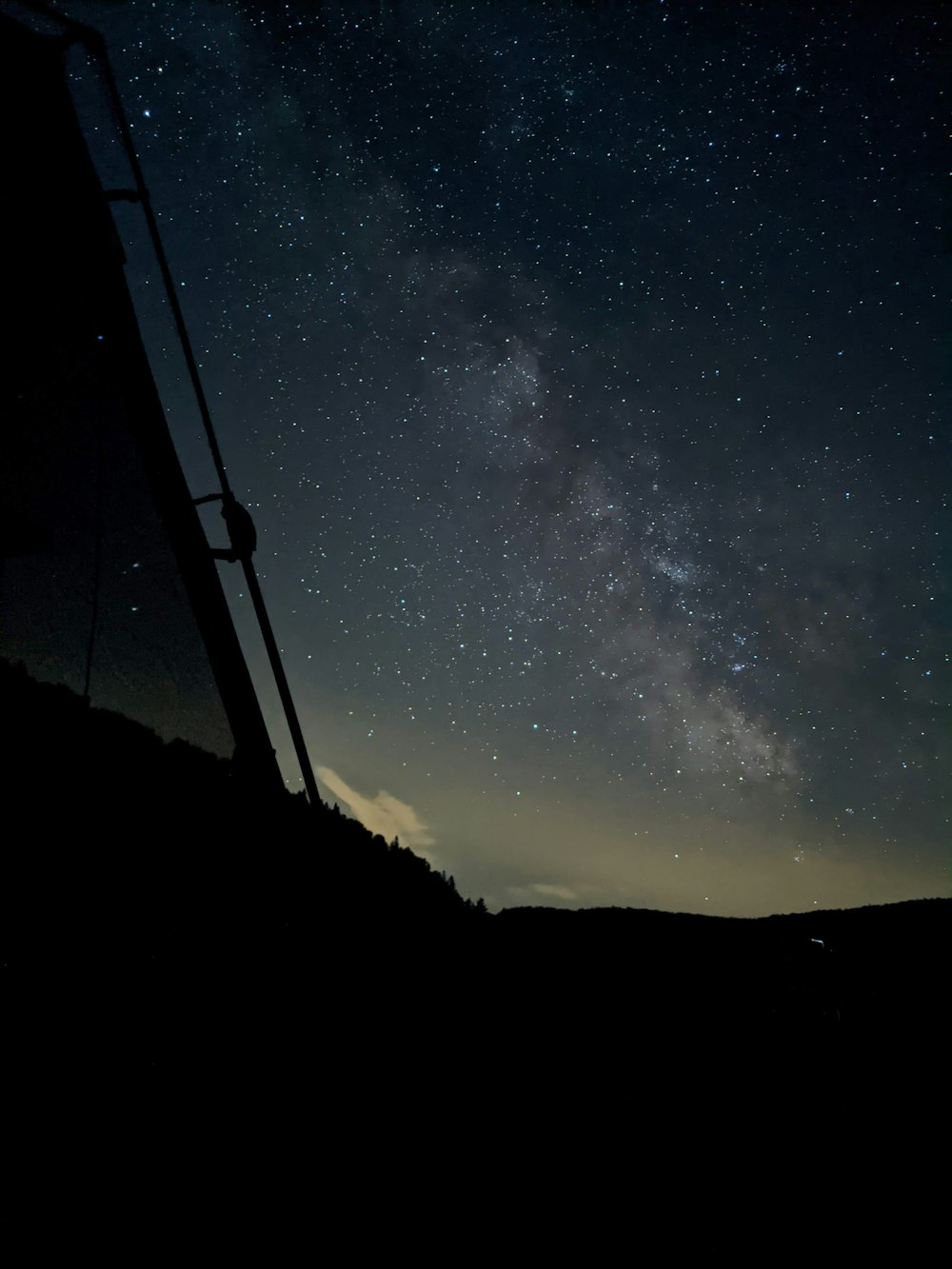 silhouette of mountain under starry night