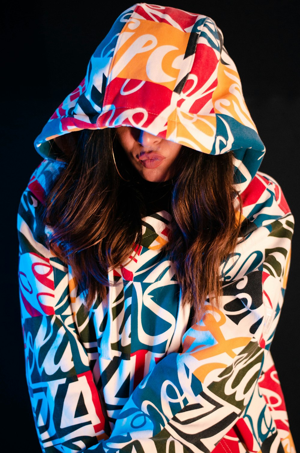 woman in blue white and red floral hoodie