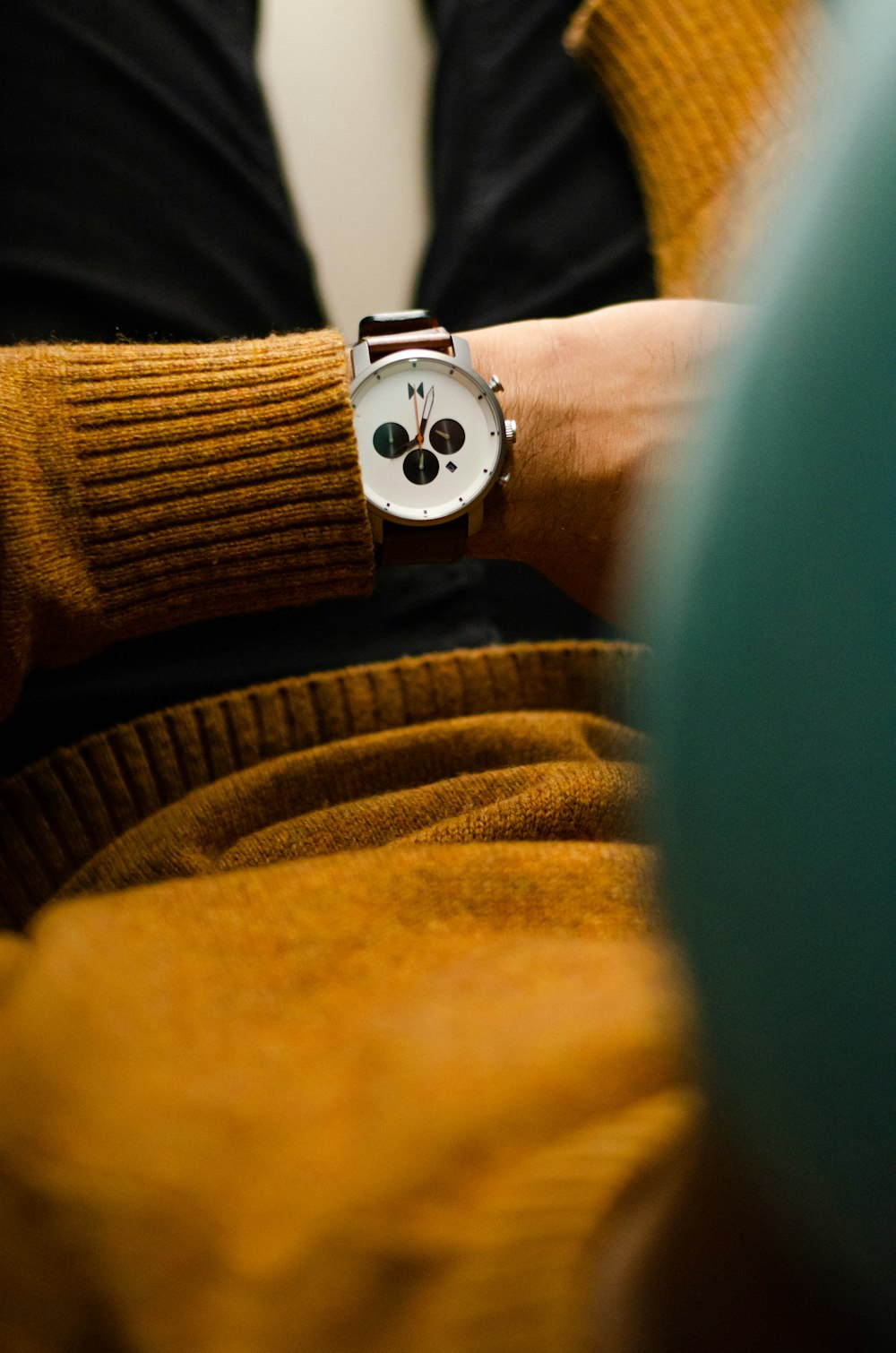 person wearing silver and white round watch