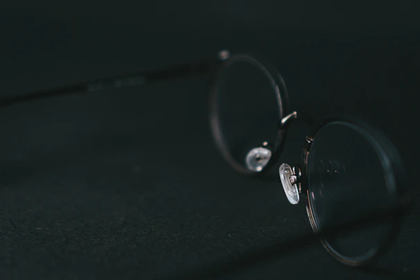 Elegant round eyeglasses showcased on a marble surface with a minimalist vibe.