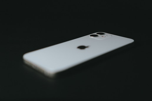 white iphone 5 c on black background