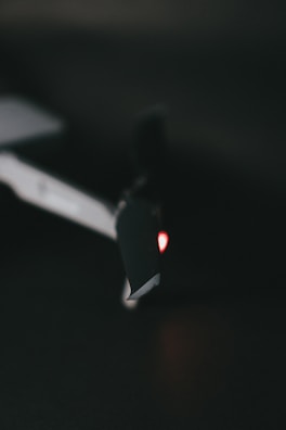 Close-up of a drone's propeller spinning against a dark backdrop.