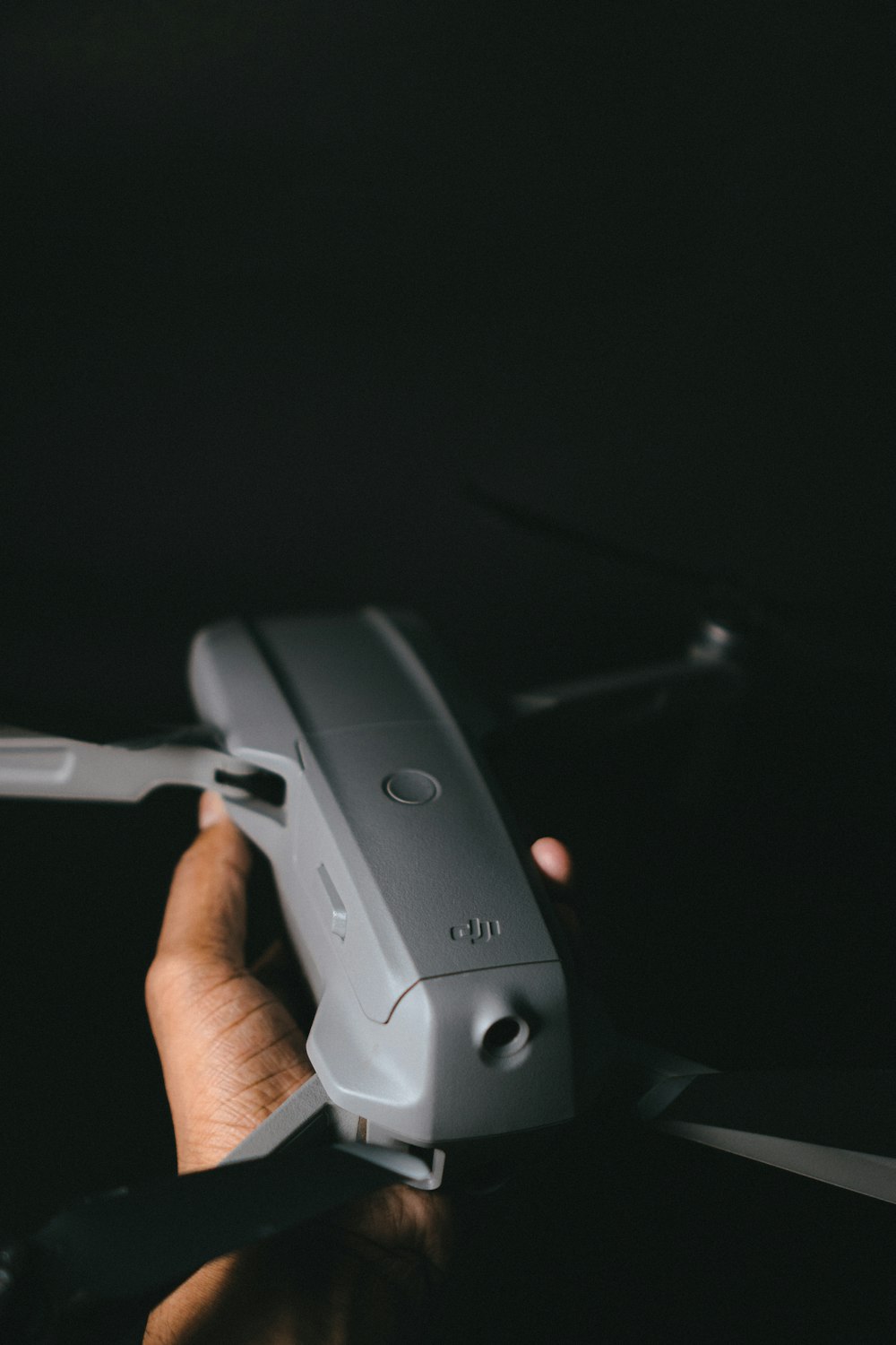 person holding gray game controller