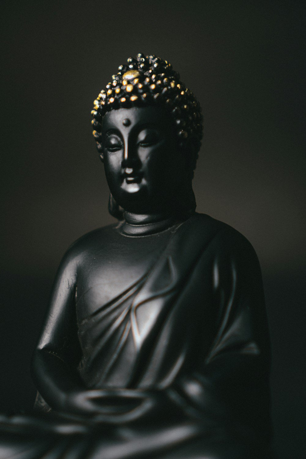 black and gold buddha statue