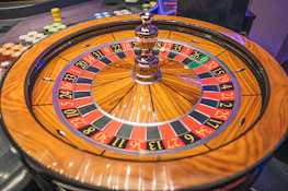Roulette wheel spinning with the ball about to land on a winning number.