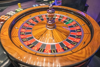 Roulette wheel spinning with colorful chips around