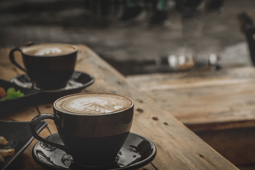 black ceramic mug on brown wooden table