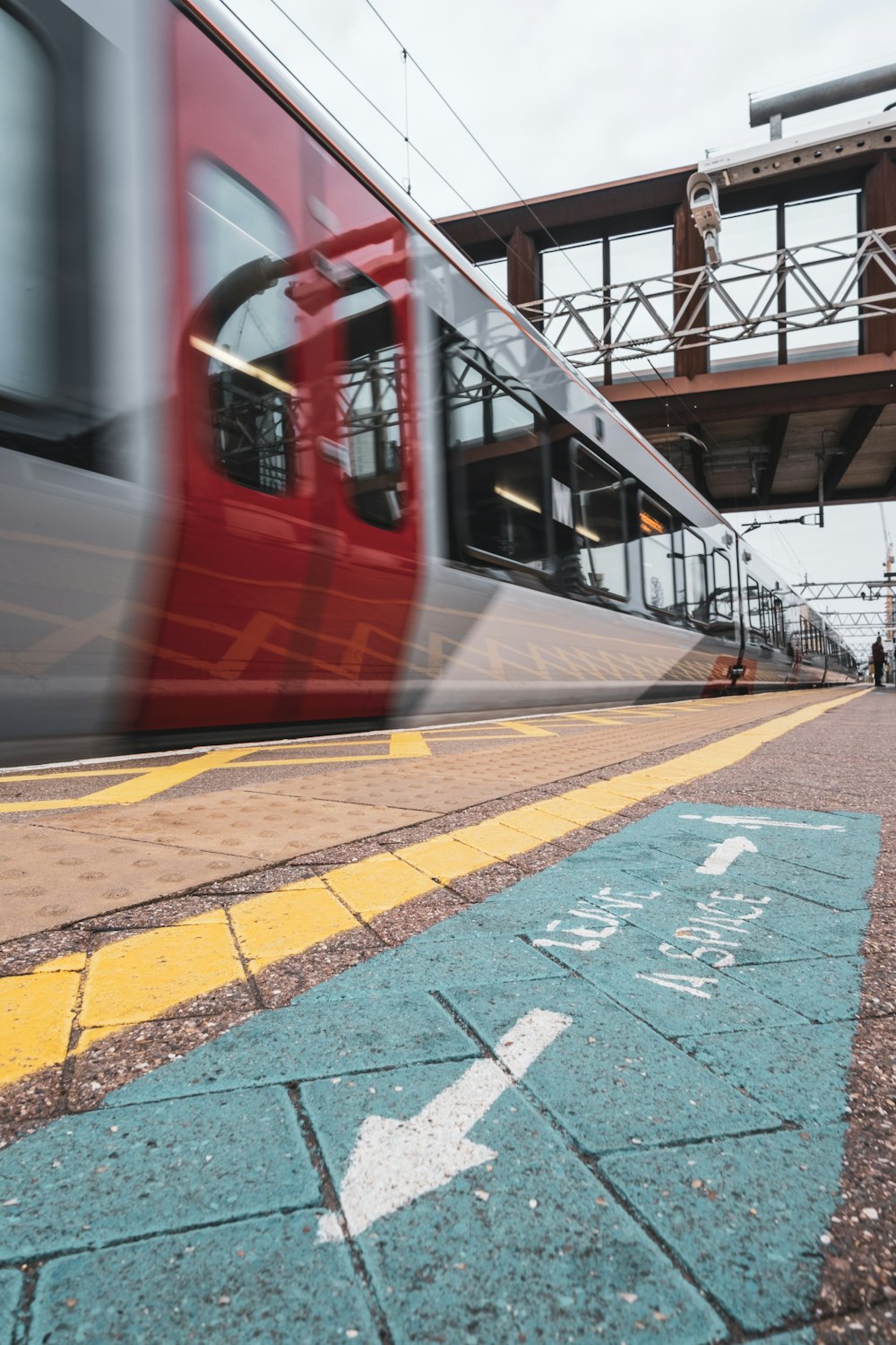 red and white train on train station during daytime