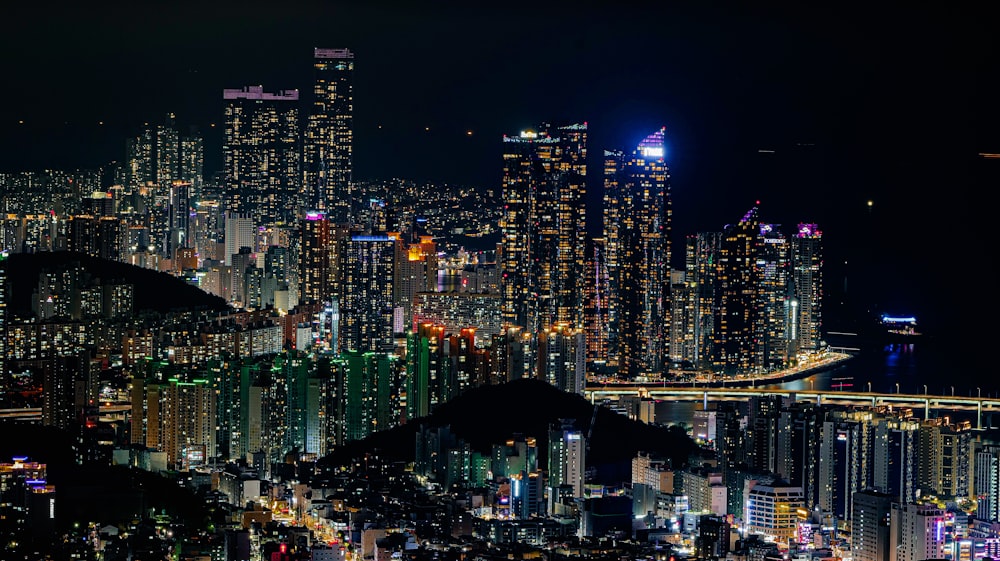 city with high rise buildings during night time